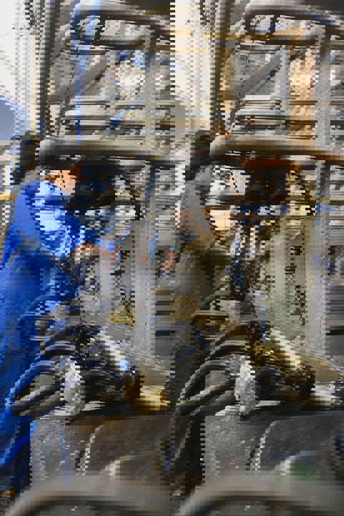 A dairy farmer cleaning milking equipment