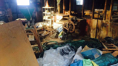 A farm shed before being organised using the Workplace Efficiency Booster