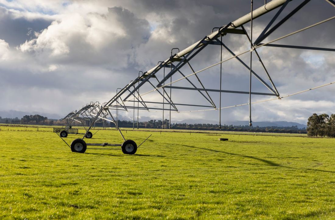 Open paddock with a travelling irrigator