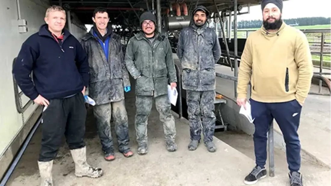 Five men standing together