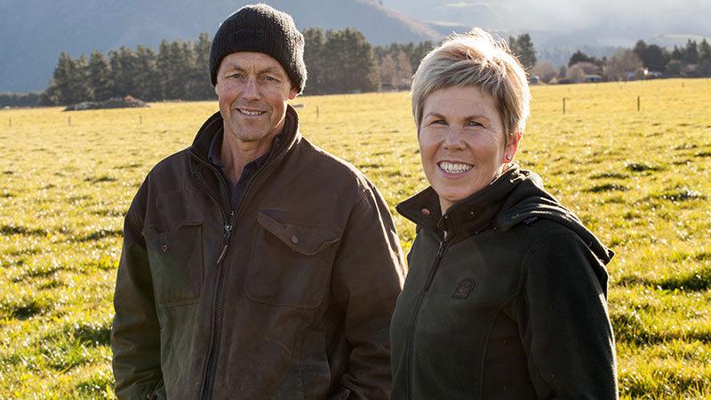 Man and Woman standing in a field