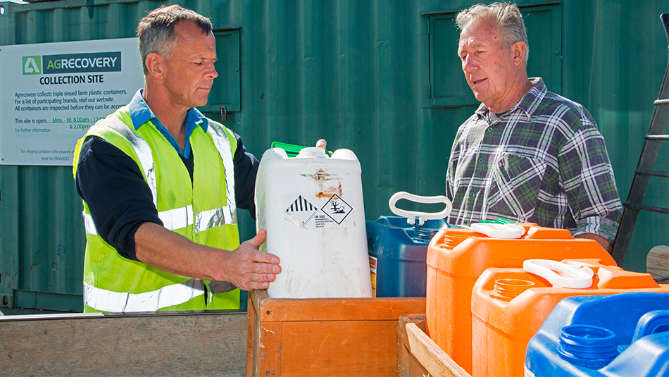 Two men looking at a container