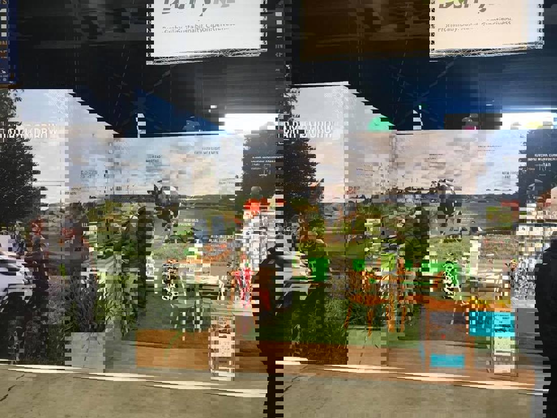 A group of people standing in front of a computer